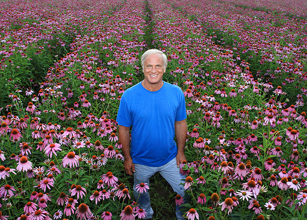 Ric Scalzo in a field of Echinacea at Gaia’s organic farm in Brevard, North Carolina.